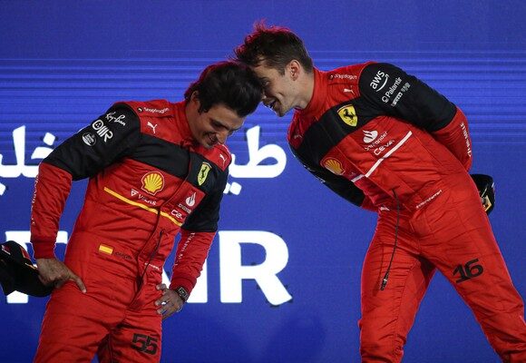epa09838923 Winner Monaco's Formula One driver Charles Leclerc (R) of Scuderia Ferrari celebrates with his teammate second placed Spanish Formula One driver Carlos Sainz after the Formula One Grand Prix of Bahrain at the Bahrain International Circuit in Sakhir, Bahrain, 20 March 2022.  EPA/ALI HAIDER