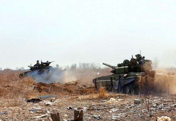 Service members of pro-Russian troops are seen atop of tanks during Ukraine-Russia conflict on the outskirts of the besieged southern port city of Mariupol, Ukraine March 20, 2022. REUTERS/Alexander Ermochenko