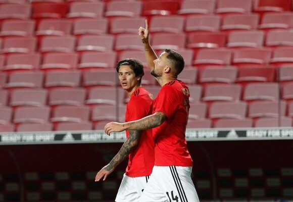 epa08776205 Benfica's Lisbon player Haris Seferovic (R) celebrates after scoring the 1- 0 against Belenenses SAD during the Portuguese First League soccer match between Benfica Lisbon and Belenenses SAD at Luz Stadium in Lisbon, Portugal, 26 ctober 2020.  EPA/ANTONIO COTRIM