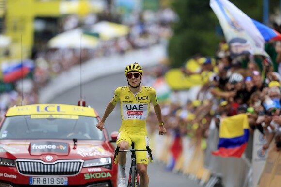 epa11487872 Yellow jersey Slovenian rider Tadej Pogacar of UAE Team Emirates celebrates as he crosses the finish line to win the 19th stage of the 2024 Tour de France cycling race over 144km from Embrun to Isola 2000, France, 19 July 2024.  EPA/GUILLAUME HORCAJUELO